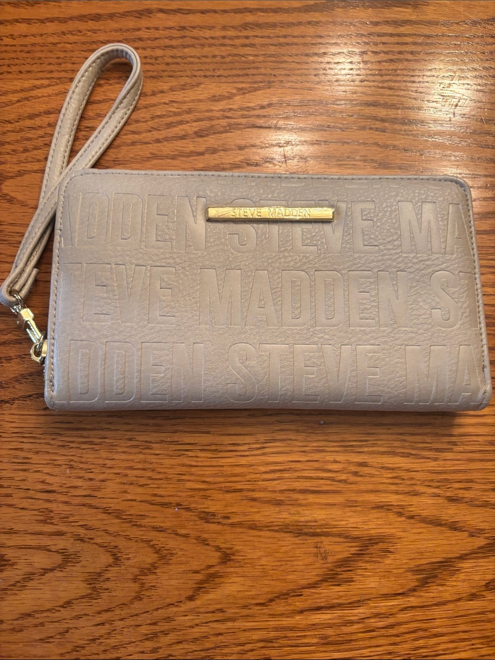 Steve Madden Neutral Embossed Logo Wristlet in Taupe